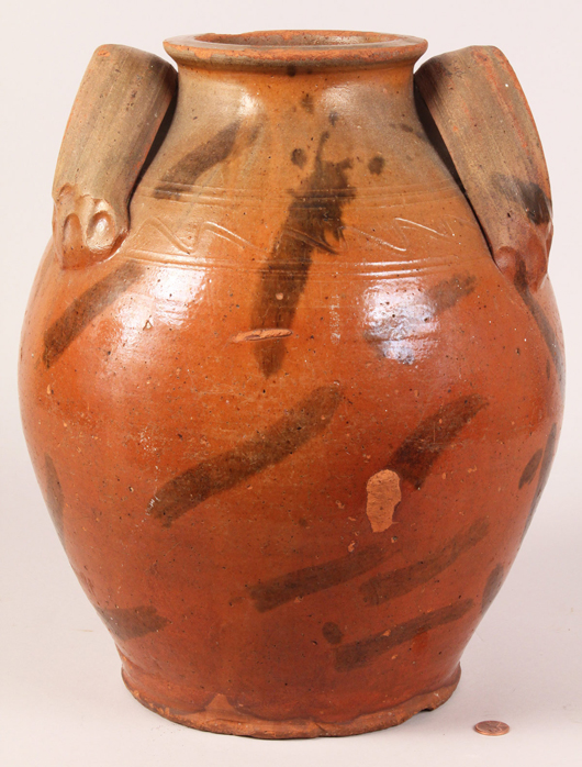  Redware jar attributed to the Cain Pottery of Sullivan County, Tennessee, $12,650. Image courtesy Case Antiques.